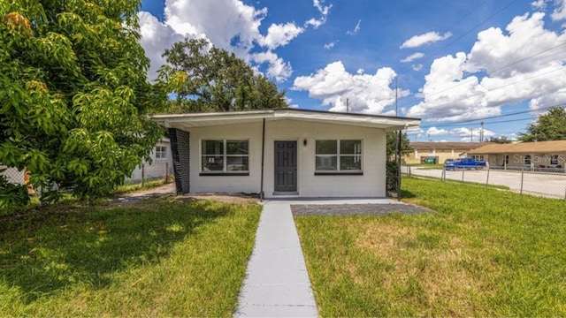 bungalow with a front lawn