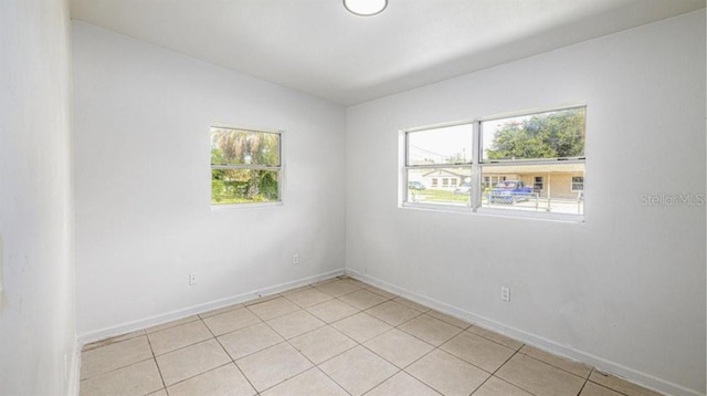 empty room with lofted ceiling