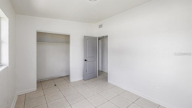 unfurnished bedroom with a closet