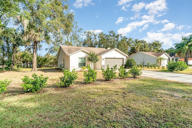 single story home featuring a garage and a front lawn