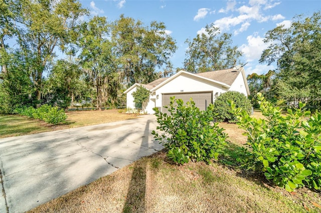 view of side of property featuring a garage