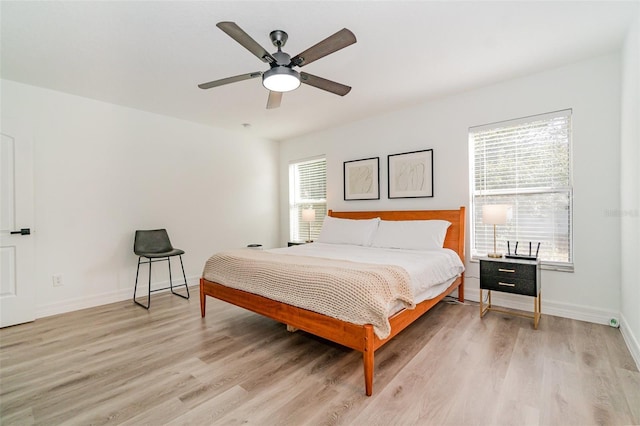 bedroom featuring light hardwood / wood-style floors and ceiling fan