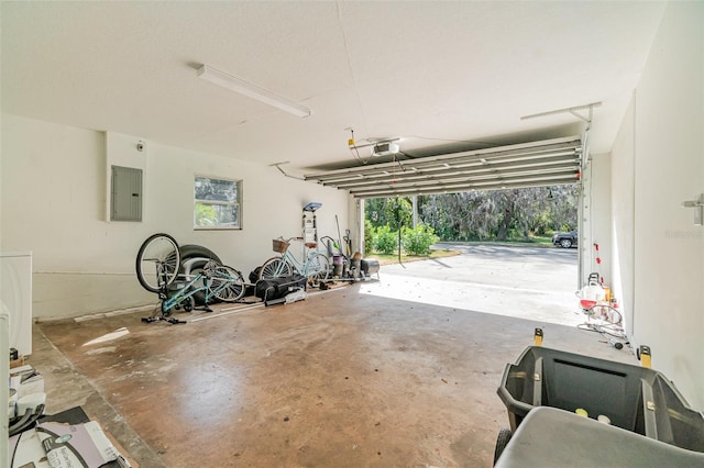 garage featuring a garage door opener and electric panel