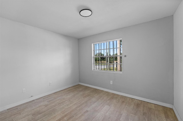 spare room with light hardwood / wood-style flooring