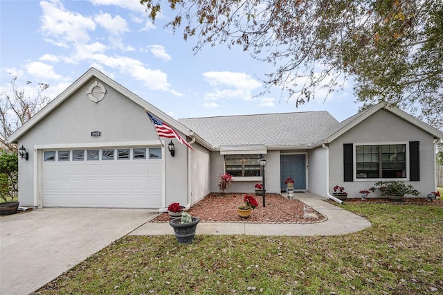 single story home with a garage and a front lawn