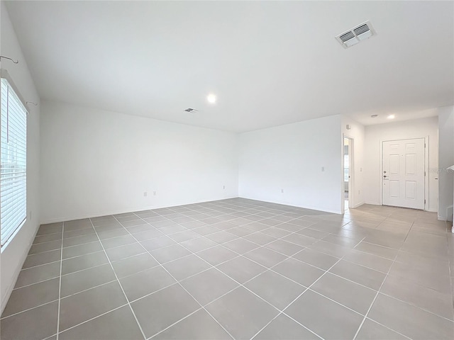 empty room featuring light tile patterned floors