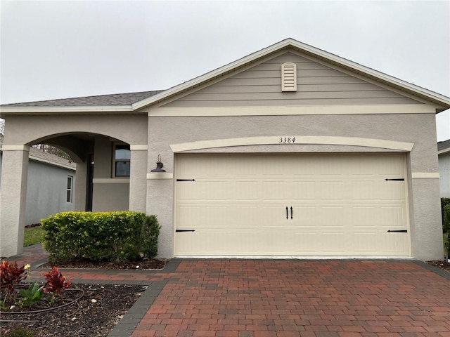 view of front of property featuring a garage