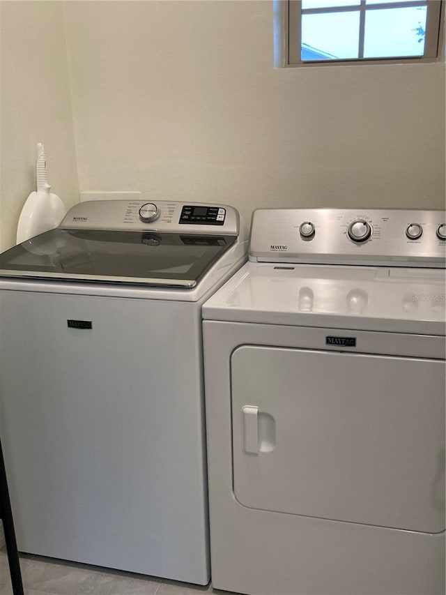 laundry area with washing machine and clothes dryer