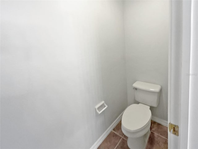 bathroom featuring toilet and tile patterned floors