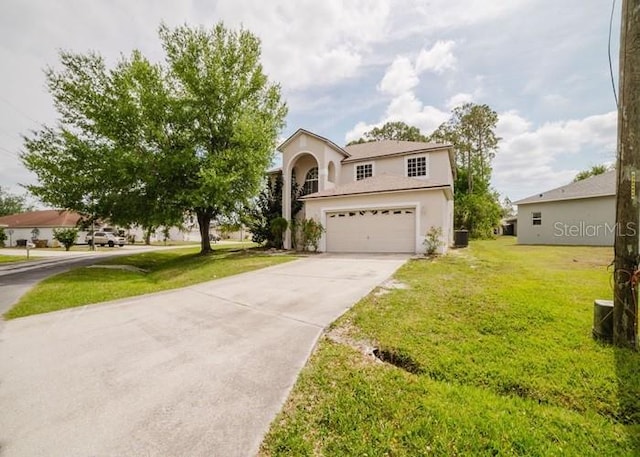 1010 Embrun Ct, Kissimmee, FL 34759 - view of front facade featuring concrete driveway, an attached garage, a front lawn, and stucco siding