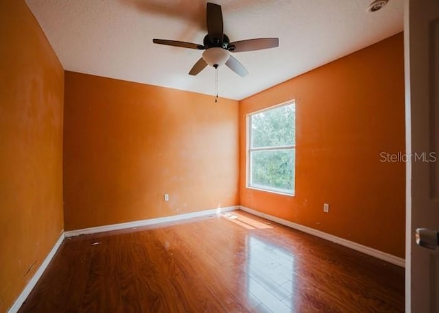 1010 Embrun Ct, Kissimmee, FL 34759 - empty room featuring baseboards, ceiling fan, and wood finished floors