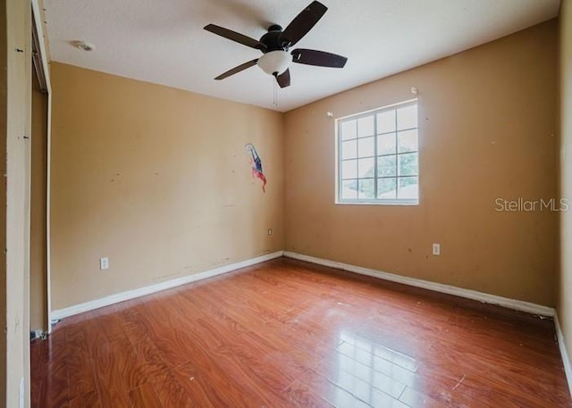1010 Embrun Ct, Kissimmee, FL 34759 - unfurnished room with baseboards, ceiling fan, and wood finished floors