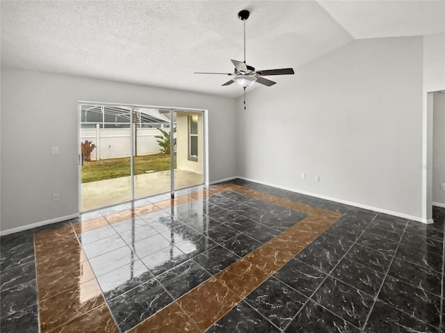 empty room with vaulted ceiling, ceiling fan, and a textured ceiling