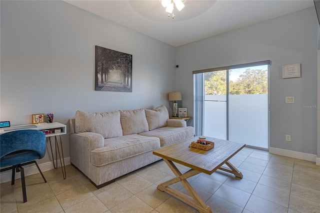 tiled living room with ceiling fan