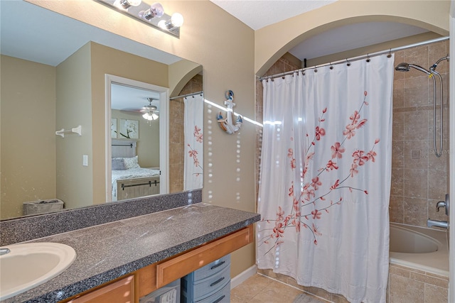 bathroom featuring vanity, tile patterned floors, and shower / bath combo with shower curtain