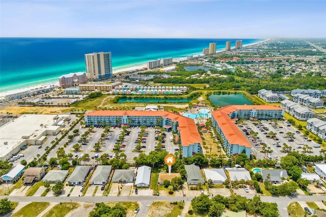 aerial view featuring a water view and a view of the beach