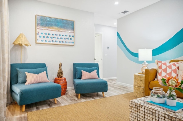 sitting room with light hardwood / wood-style flooring