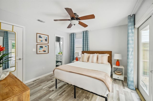 bedroom with ceiling fan and light hardwood / wood-style flooring