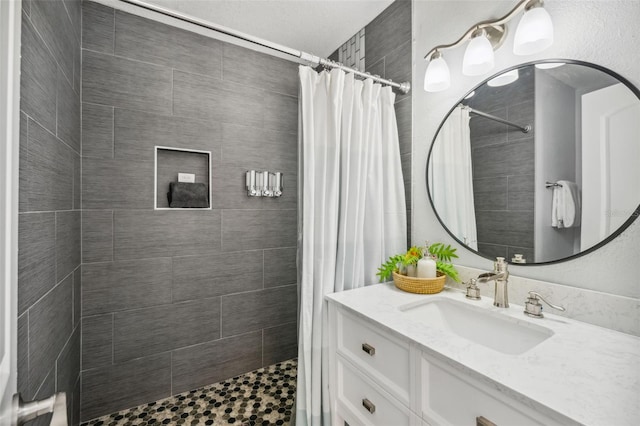 bathroom featuring vanity and a shower with curtain