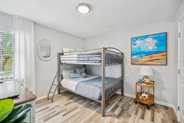 bedroom with light wood-type flooring