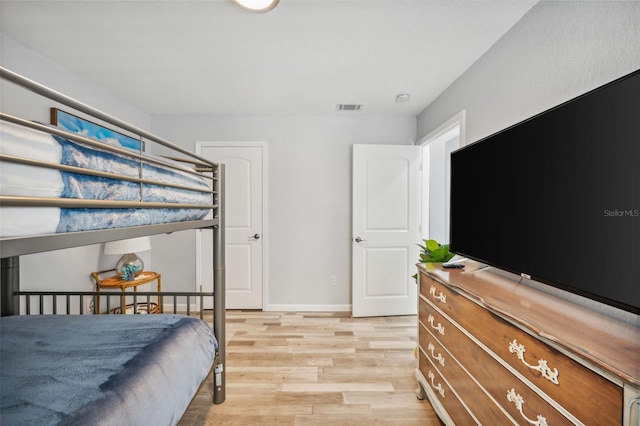 bedroom featuring light hardwood / wood-style floors