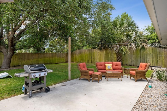 view of patio with outdoor lounge area and a grill