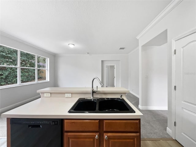 kitchen featuring crown molding, a kitchen island with sink, black dishwasher, and sink