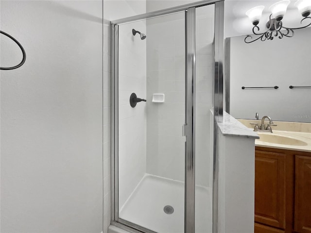 bathroom with vanity and an enclosed shower