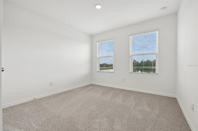 unfurnished room with carpet flooring