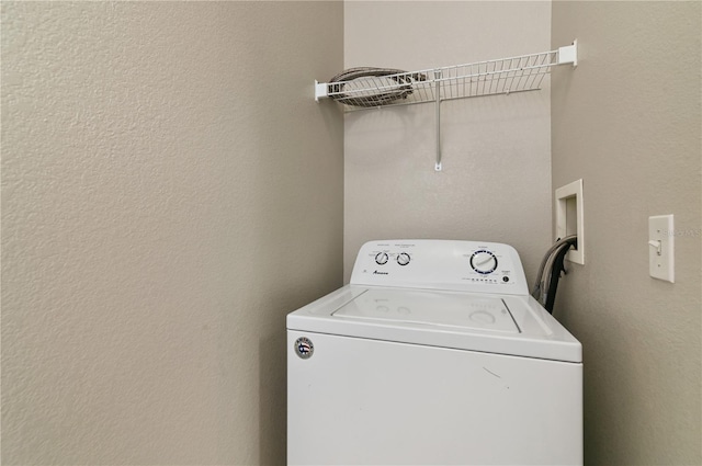 washroom with washer / dryer