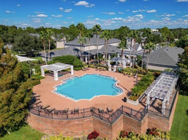 view of swimming pool with a pergola and a patio