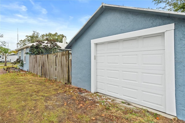 garage with a yard