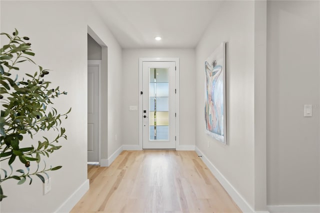 doorway to outside with light hardwood / wood-style floors