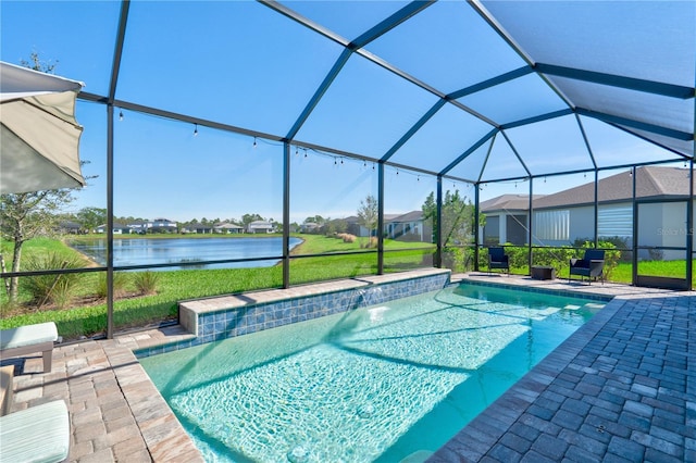 view of swimming pool featuring a patio, a water view, and glass enclosure