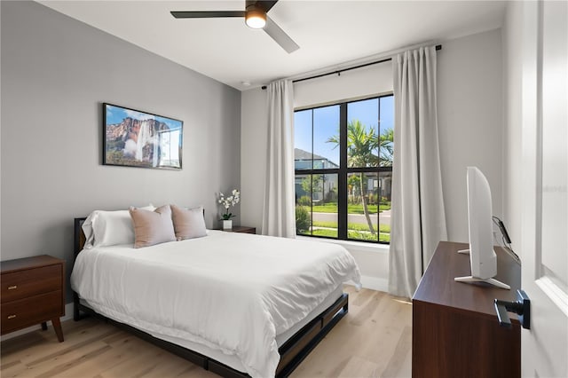 bedroom featuring ceiling fan and light wood-type flooring