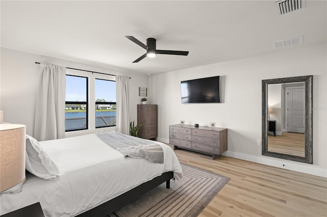 bedroom featuring light wood-type flooring and ceiling fan