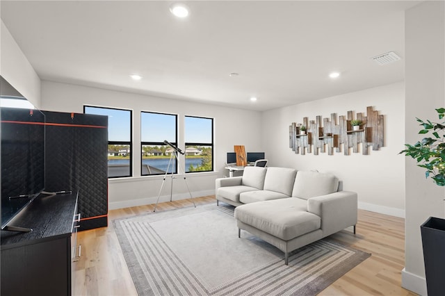 living room with light hardwood / wood-style floors