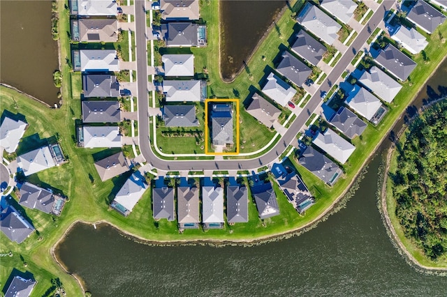 birds eye view of property featuring a water view