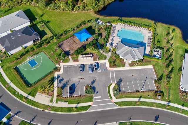 birds eye view of property with a water view