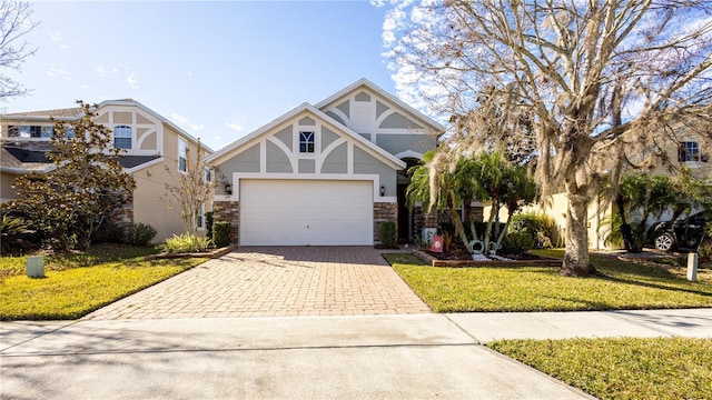 view of front facade featuring a garage and a front lawn