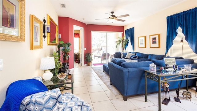 tiled living room featuring ceiling fan