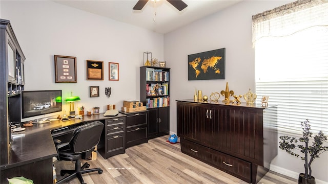 office with ceiling fan and light wood-type flooring