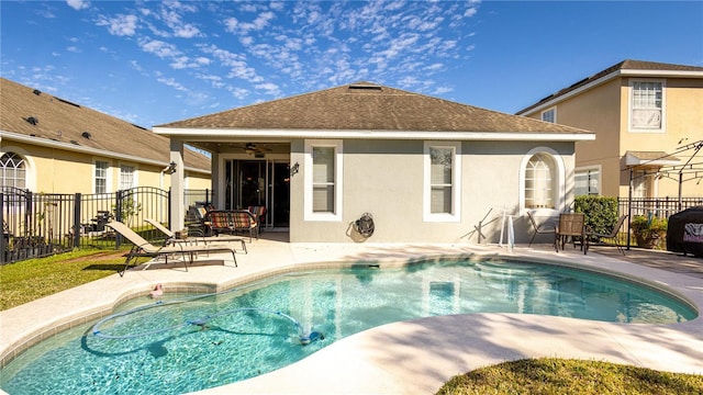 view of pool featuring a patio and ceiling fan