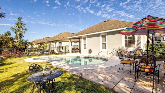 view of pool featuring a yard and a patio area