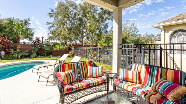 view of patio / terrace featuring a fenced in pool and an outdoor hangout area