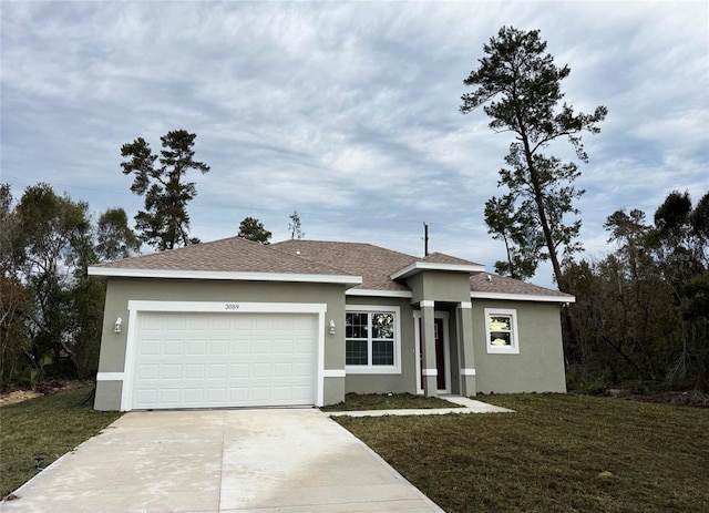 view of front of home with a garage and a front lawn