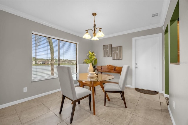 tiled dining area featuring an inviting chandelier and crown molding