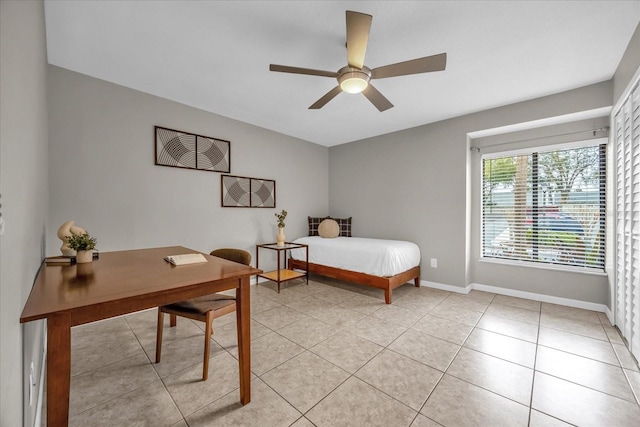 bedroom with ceiling fan and light tile patterned floors