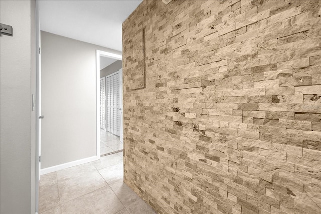 hall featuring light tile patterned floors