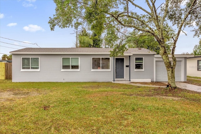 single story home with a garage and a front yard